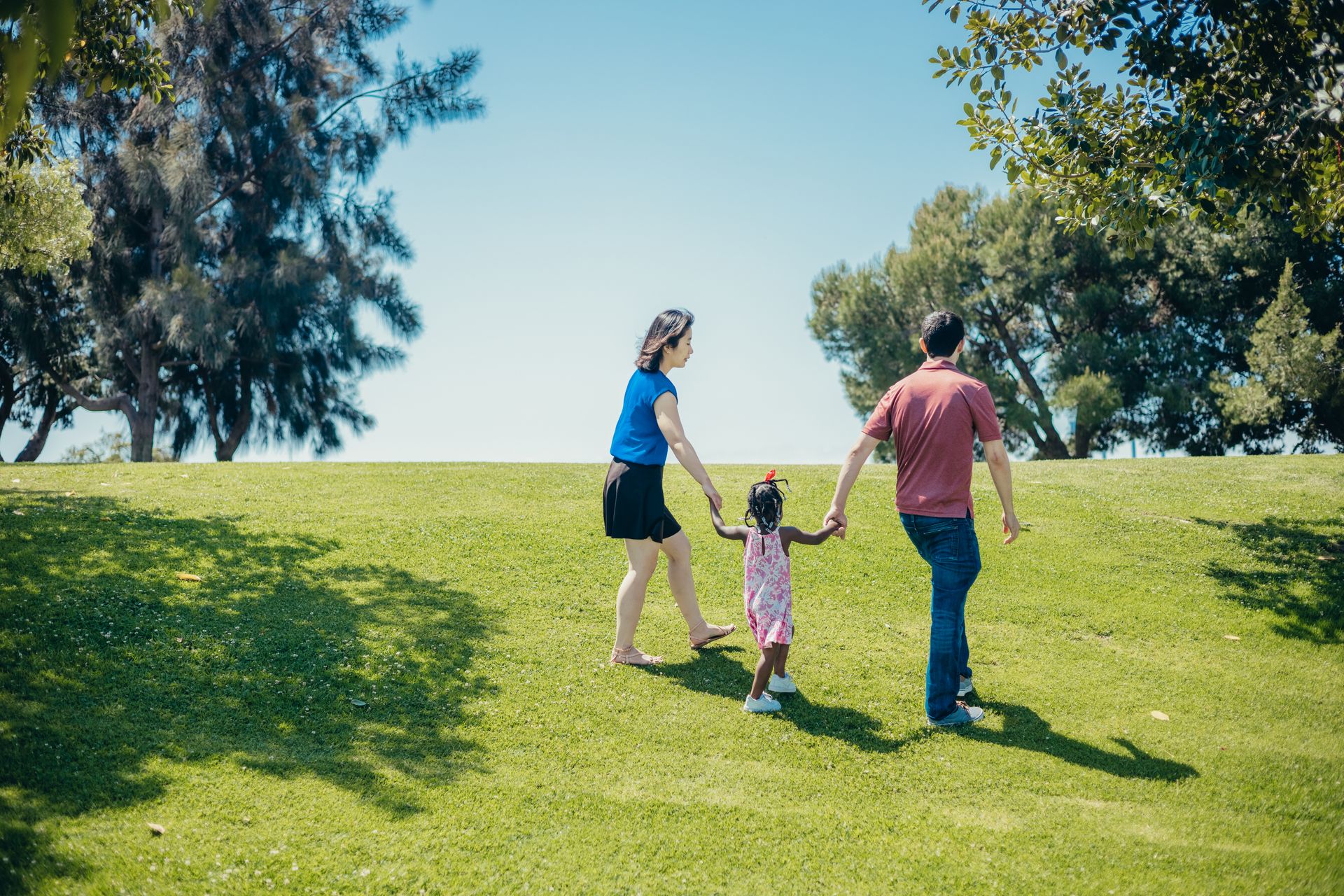 Family walking together in a community park