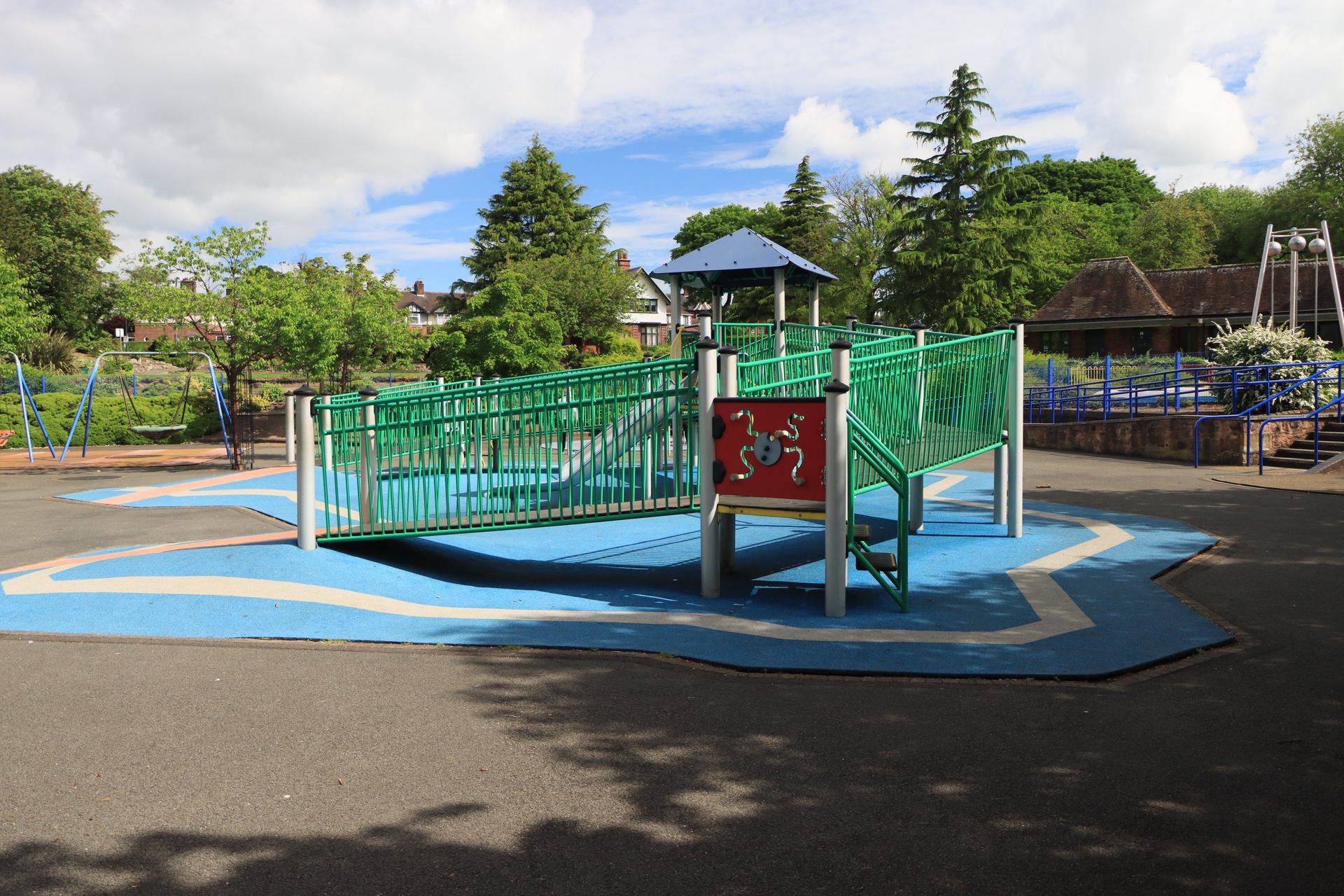 Inclusive playground with ramp access on rubber surfacing