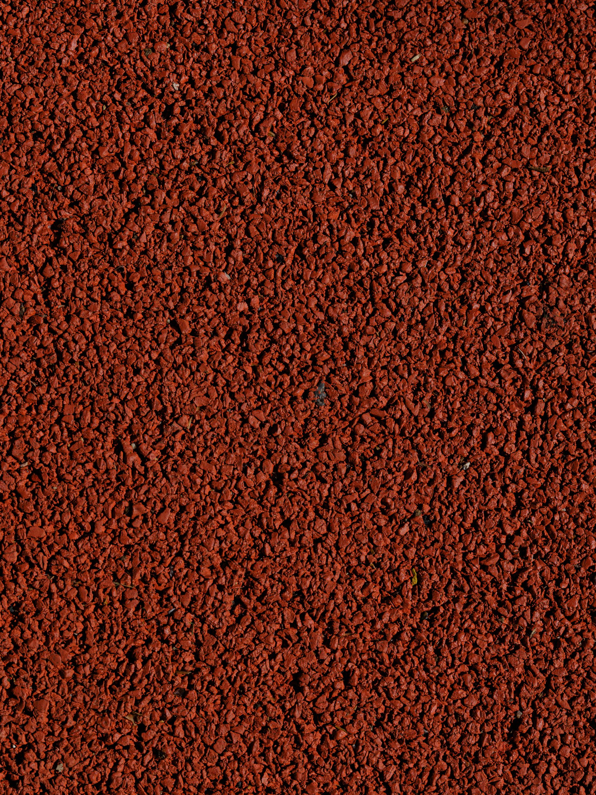Close-up of red rubber safety surfacing