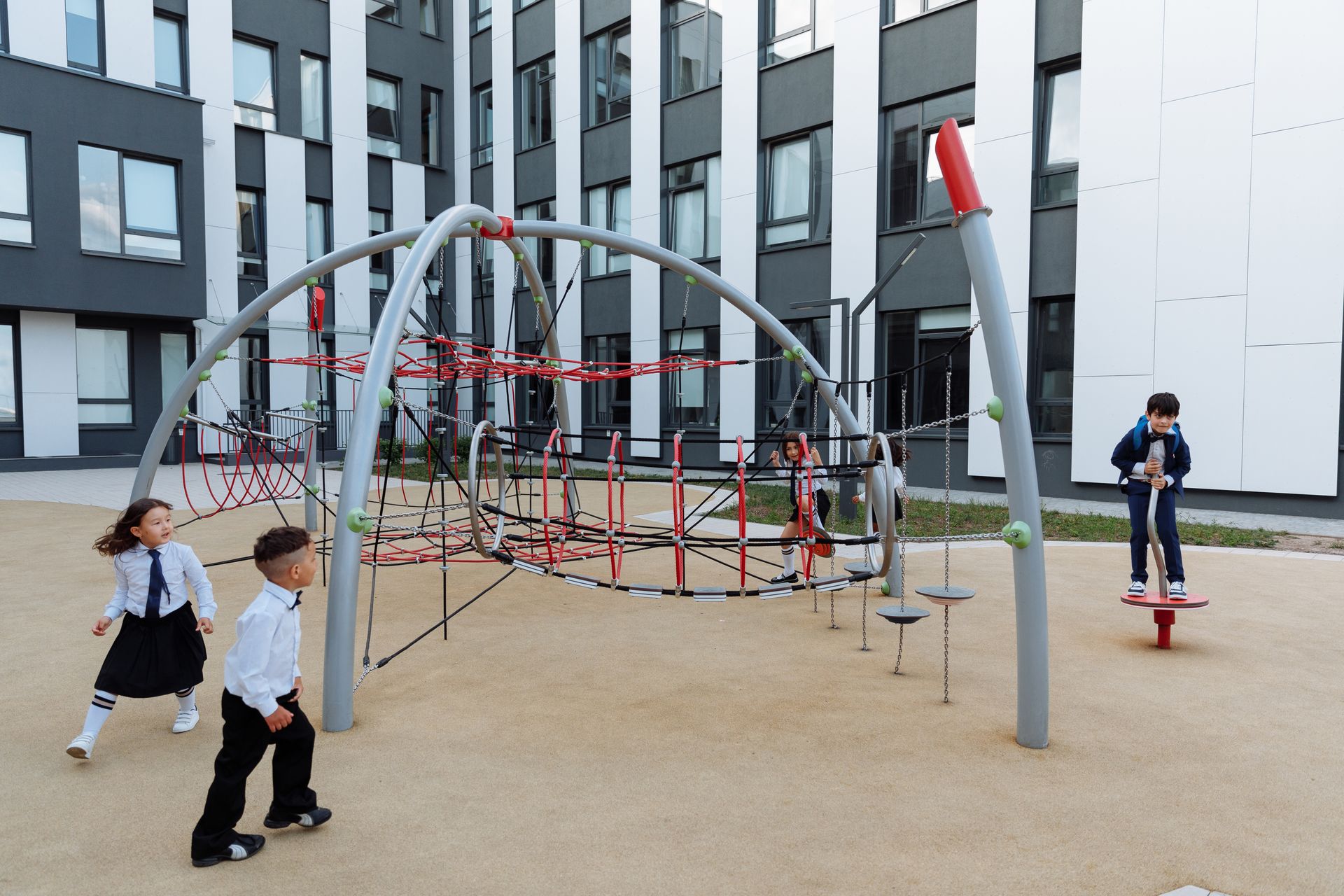 Students on a modern school playground climber